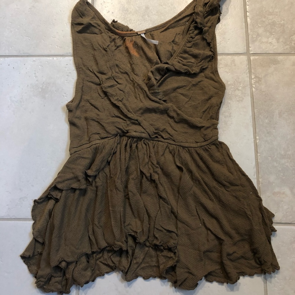 Free people green tank top. Slightly damaged.